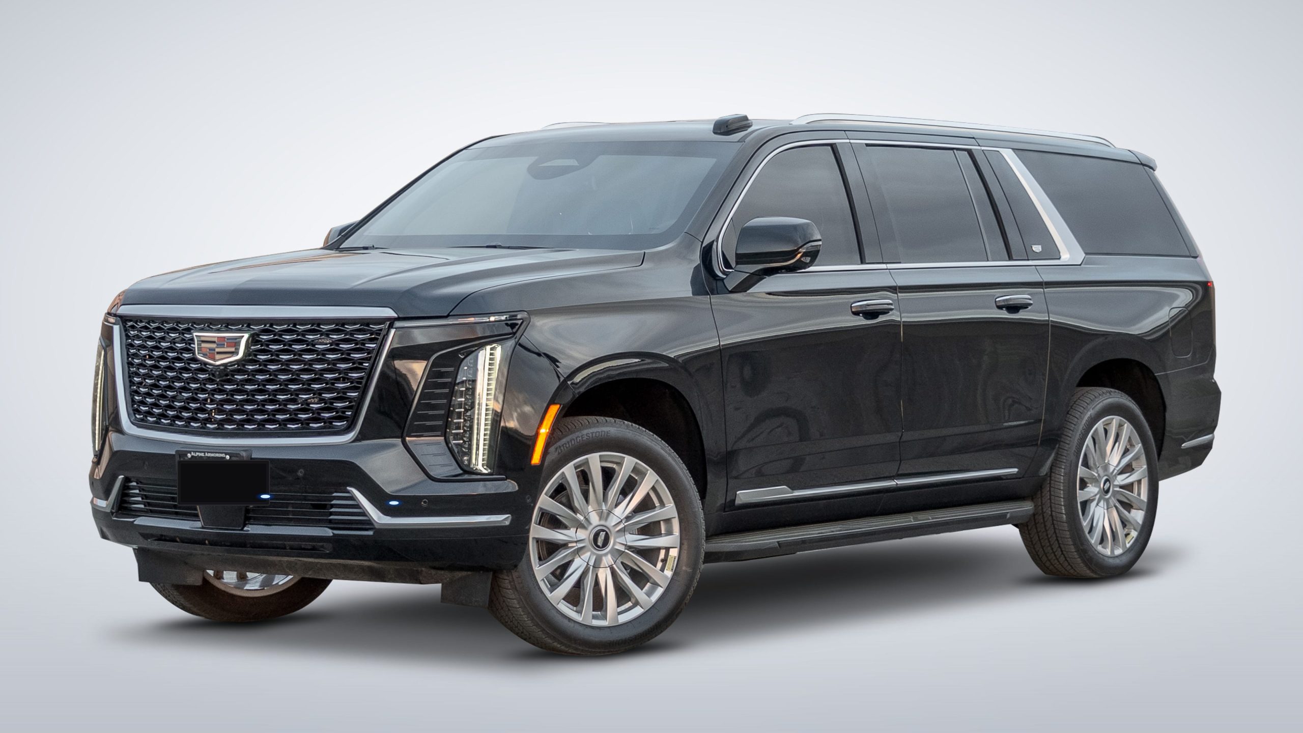 Armoured Cadillac Escalade ESV front three-quarter studio photography on white infinity cyclorama